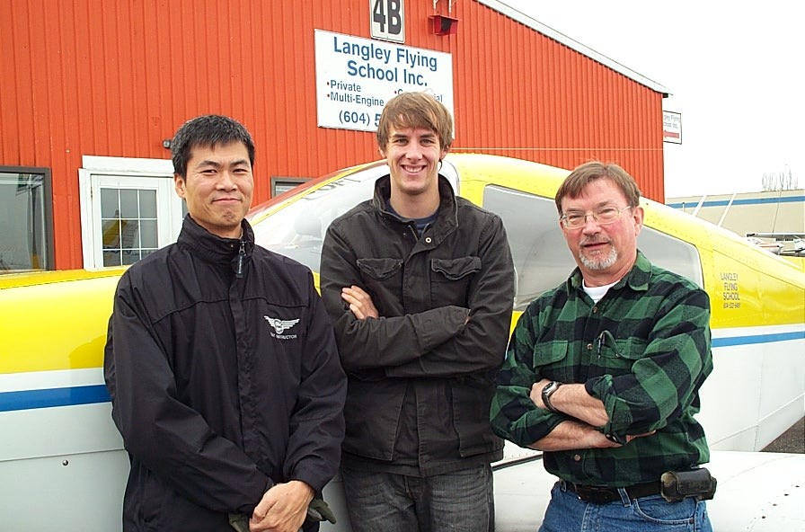 Neil Mitchell with his Flight Instructor Hoowan Nam and Pilot Examiner John Richardson after the successful completion of Neil's Commercial Pilot Flight Test on November 24, 2010.  Langley Flying School.